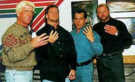 flair, benoit, malenko and anderson share the salute